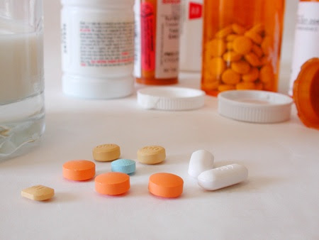 taking prescription pill with milk