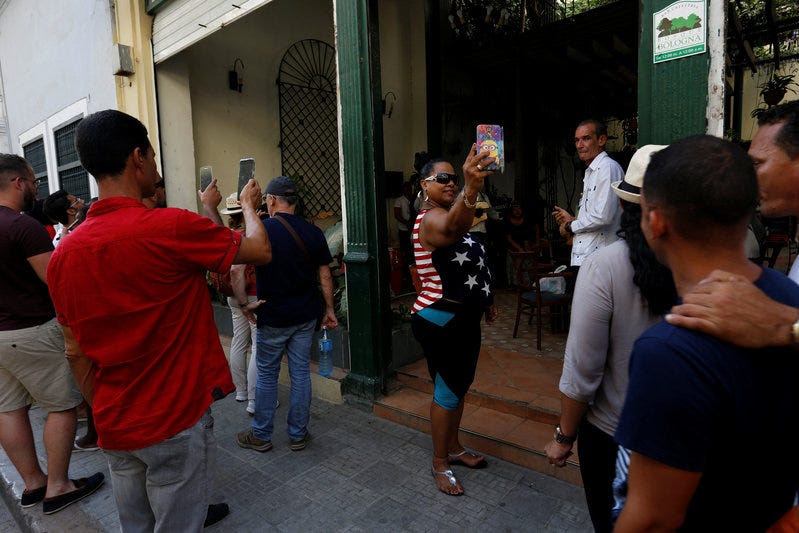 Tourists take pictures in Havana, Cuba June 13, 2017. REUTERS/Stringer