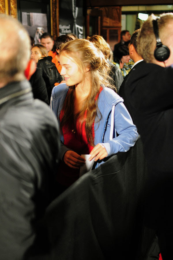 Blue Hoodie, red shirt & long blonde hair.