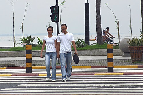 walking strolling around baywalk area while holding hands manila Pinoy 