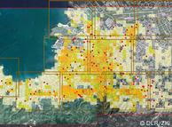 ZKI image of Haiti; in addition to color-coded squares denoting the extent of the damage, the maps are populated with red dots refering to points where international aid organizations can set up