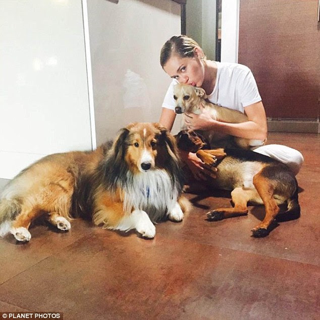 Furry friends: Miley, who took to Instagram earlier this week to share a picture of her pets, has been vegan since the death of her beloved dog Floyd, who was mauled by a coyote last year 