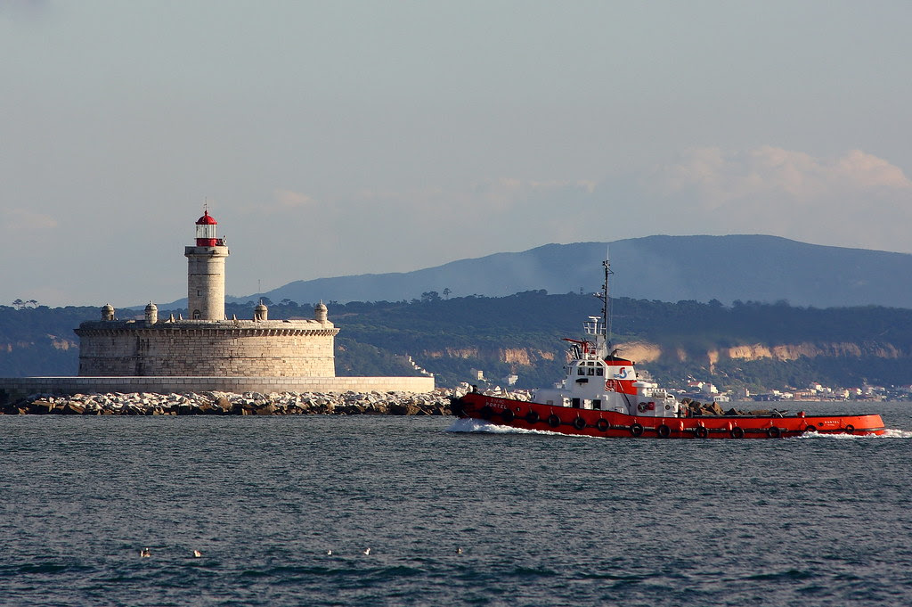 The lighthouse and the towboat