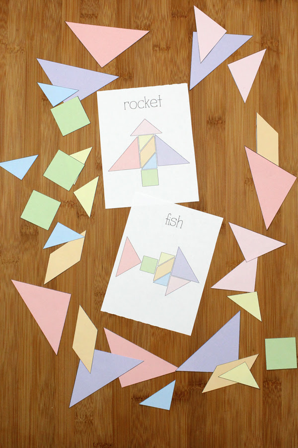 rocket and fish challenge cards surrounded by shape pieces
