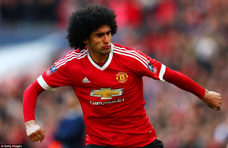 Marouane Fellaini celebrates                  after giving Manchester United the lead against Everton                  in Saturday's FA Cup semi-final at Wembley