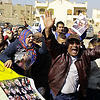 Supporters of former Egyptian President Hosni Mubarak celebrate after hearing the verdict of his trial outside a police academy on the outskirts of Cairo, Saturday, Nov. 29, 2014. (AAP)
