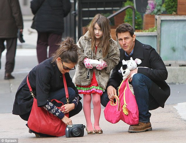 Sights to see: The trio took in the sounds and smells of New York and Katie was carrying a large camera