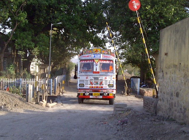 A Truck Crossing the Railway Track - From PrayagDham to Pune Solapur Highway - Visit Dreams Nivara, Ready Possession 2 BHK Flats near Prayag-Dham at Koregaon Mul, Uruli Kanchan, Pune Solapur Highway, Pune 412 202