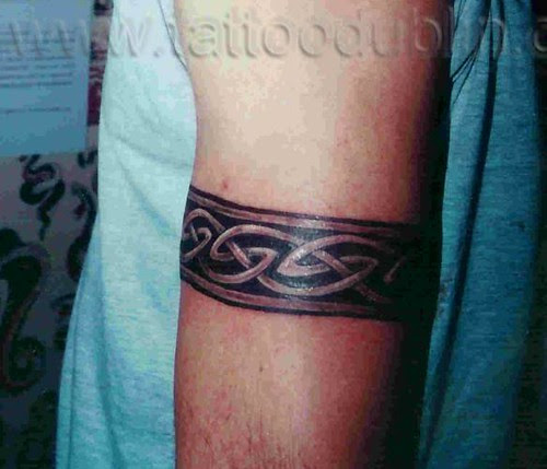 celtic armband tattoo by dublin ireland tattoo artist 'Pluto' while 