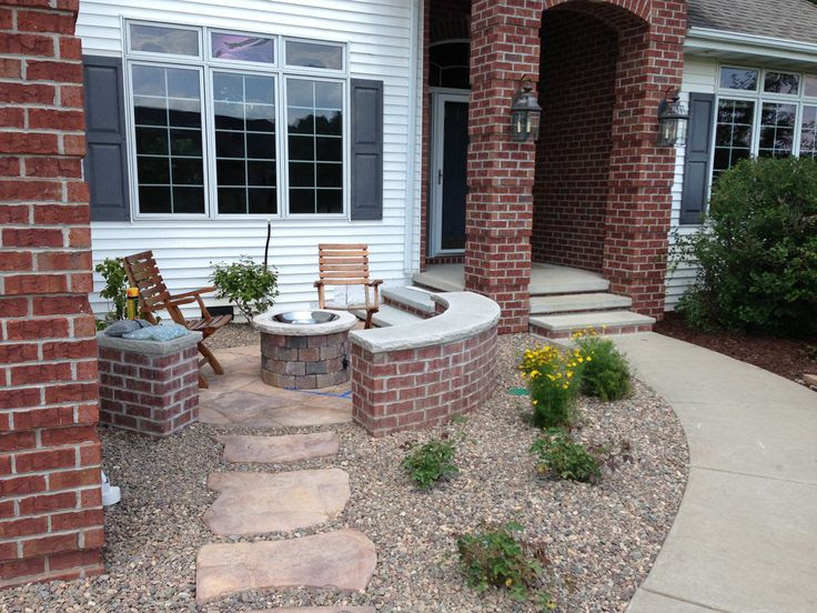 A sunrise landscape patio in WI needs extra heat to extend usability.  It may be the next rage in front porches in sub-divisions that have forgotten the street and their neighbors.  By Chad Cornette at Cantilever Studio