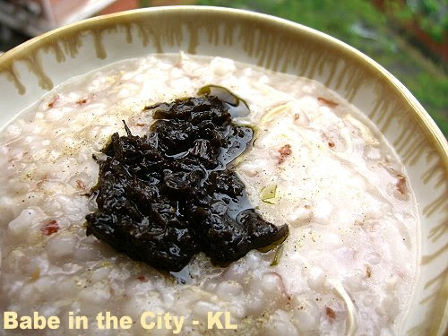 Rice Porridge topped with a dollop of Preserved Olive Leaves
