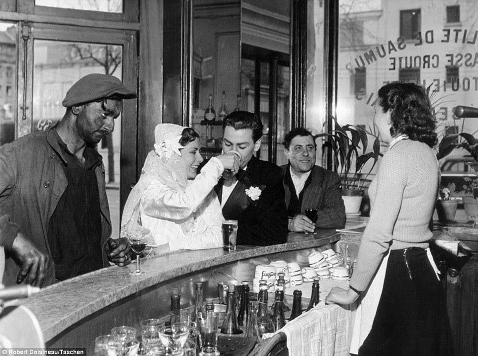 Striking: This photograph, taken in the 1950s, shows customers, including a newly married couple, enjoying a drink in a brasserie