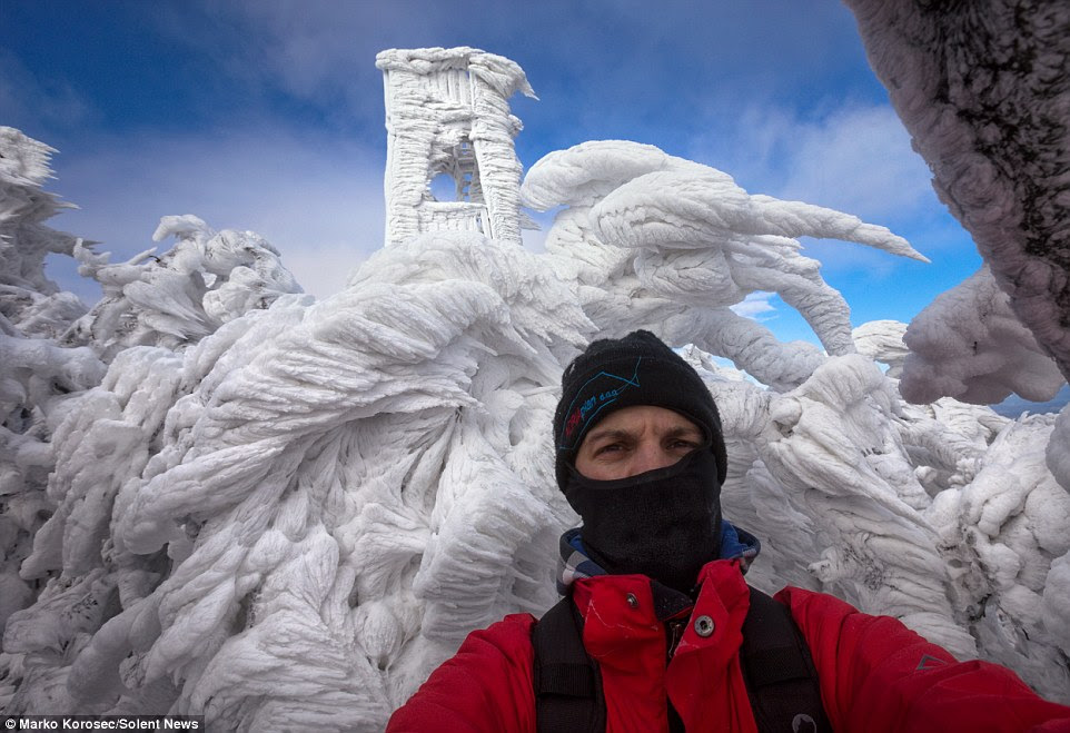 The spectacular set of images were captured by photographer Marko Korosec, pictured, who specialises in shooting in extreme weather