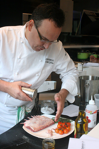 Seasoning the lamb with salt and crushed pepper