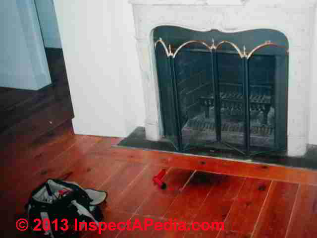 Our photo (left) shows a burned wooden floor in front of a fireplace hearth.