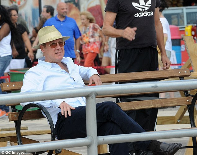 Take a pew: The star later swapped his smart attire for a white shirt and black trousers