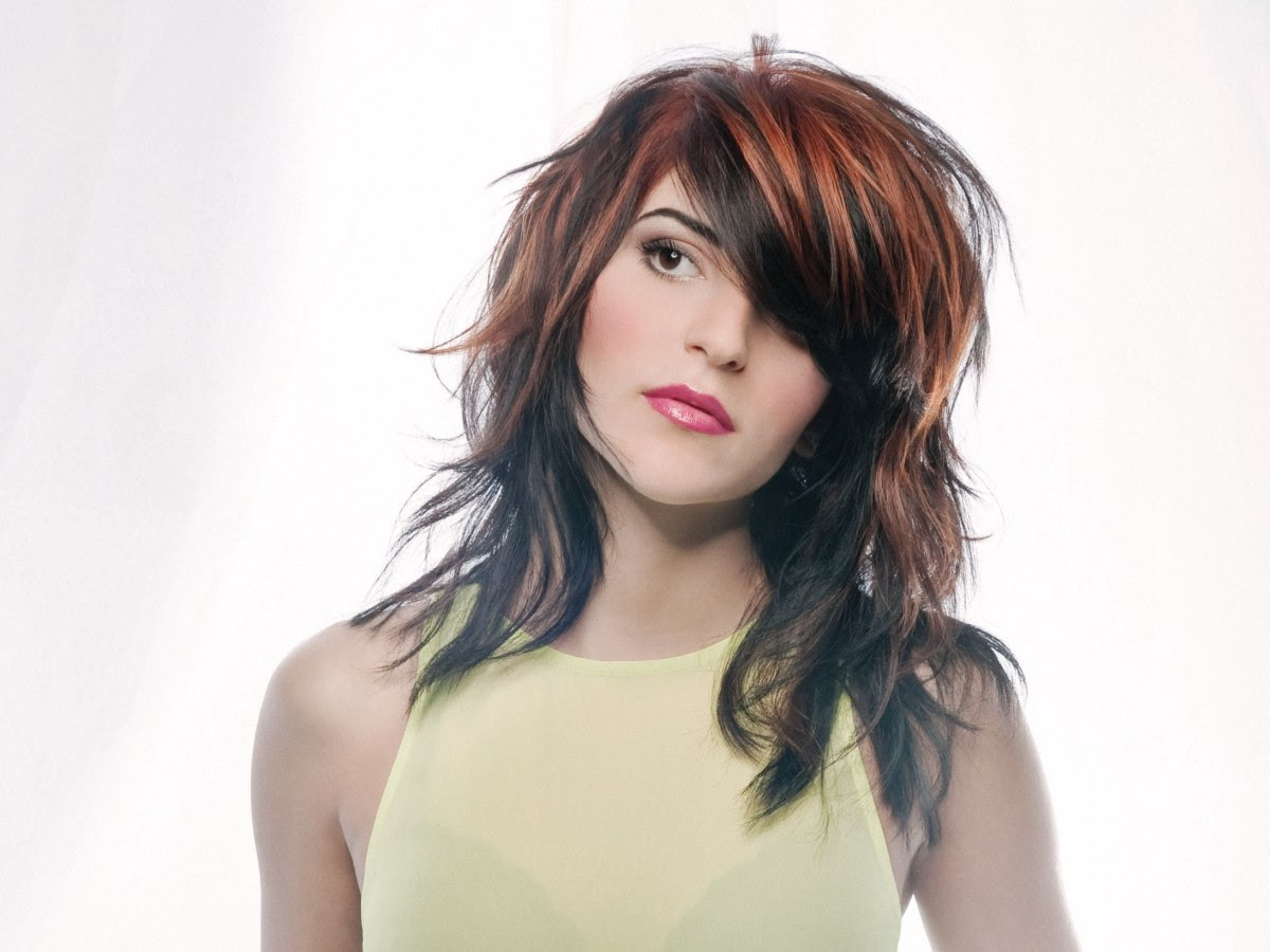 Sleek long hair with spiky styling and a bright color 