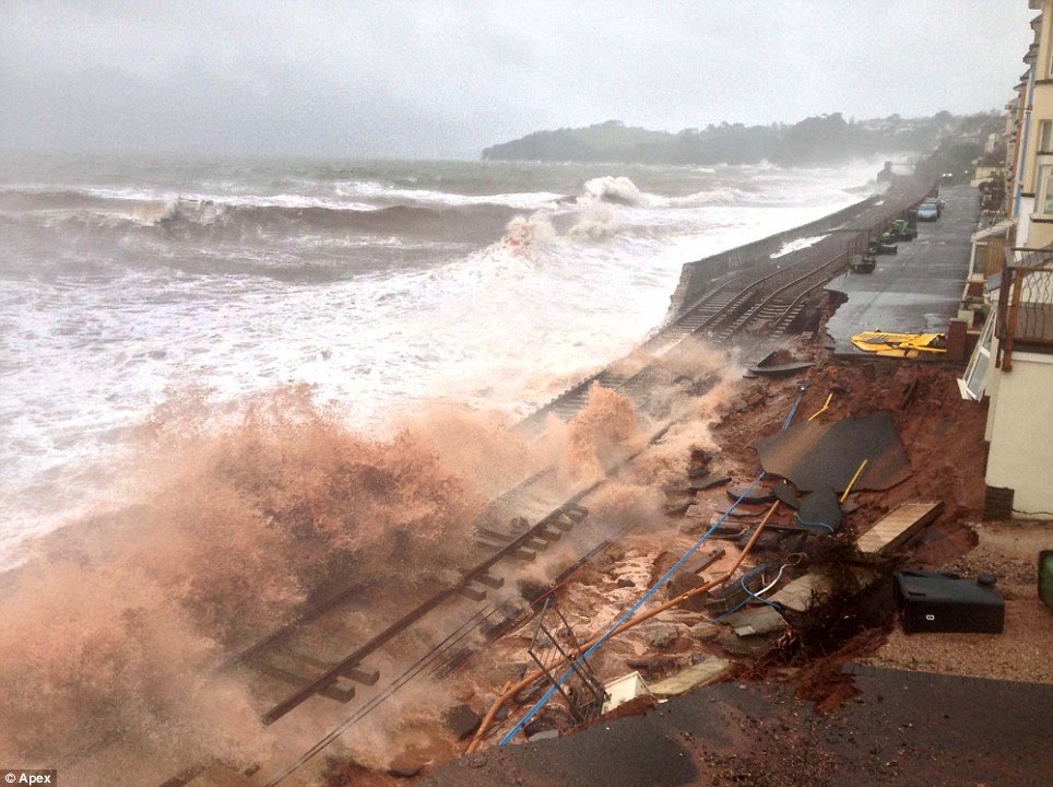 Destroyed: The track at Dawlish is impassable with rail bosses warning that services through Devon to London will be disrupted for at least today