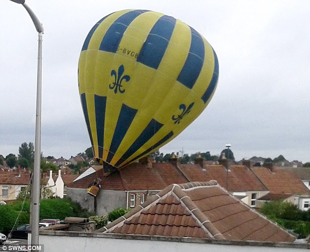 Running out of air: The hot-air balloon lost height after the father-and-son crew swapped over the gas cylinders and hit a chimney pot