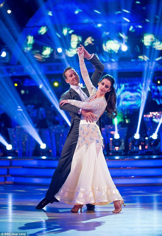 Graceful debut: The dress hugged the stunning star's curves before protruding into a flirty fishtail base while her arms were covered by glitzy embellished sleeves