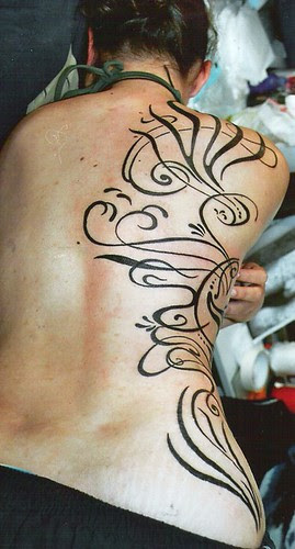 Women tribal tattoos sexy at upper back