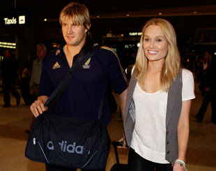 Shane Watson arrives in Sydney to meet his partner Lee Furlong after the ICC Champions Trophy success in South Africa
