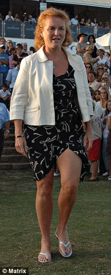 Hold on, Duchess! Fergie nearly loses her skirt on windy 