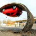 Alex Chinneck, gravity-defying artwork, art installation, ‘Pick yourself up and pull yourself together,’ Vauxhall Motors, Vauxhall Corsa, illusory artwork, tarmac, temporary art,