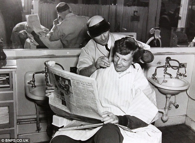 Sprucing up: Aviator Amelia Earhart has a haircut in Miami ahead of her doomed attempt to fly around the world in 1937