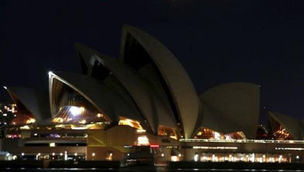 The Sydney Opera House can be seen after its lights were switched off for Earth Hour in Sydney, Australia, March 19, 2016.