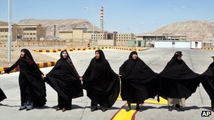 Iranian women hold hands outside the Isfahan uranium conversion facility (2005)