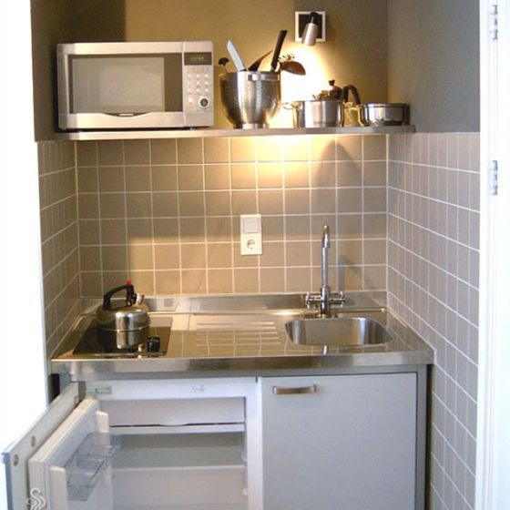 white kitchen shelves with black countertops