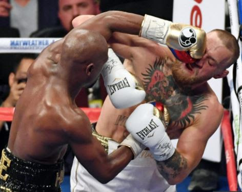Doctor says Conor McGregor suffered mild traumatic brain injury during TKO loss to Floyd Mayweather