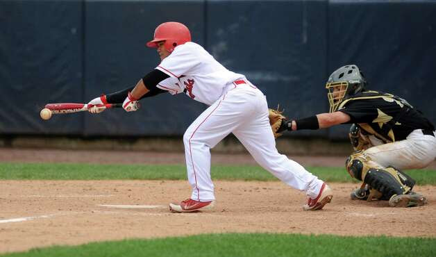 Greenwich's Cameron Fennel hits a single during Saturday's FCIAC baseball championship game at the Ballpark at Harbor Yard in Bridgeport on May 26, 2012. Photo: Lindsay Niegelberg / Stamford Advocate