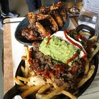 [I Ate] loaded carne asada fries & Jamaican jerk style ghost pepper wings!