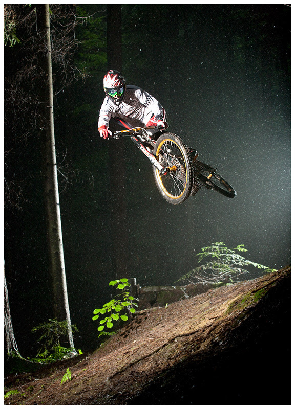 Michal Sliwa in night downhill action with his Dartmoor wheelsets