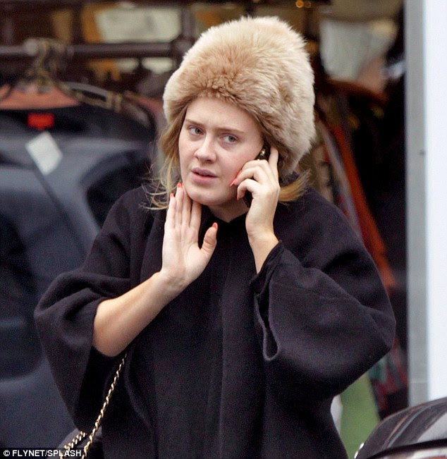 Adele shows off her slimmer figure in leggings as she enjoys a busy ...