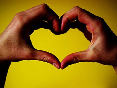 stock photo : Red Love heart in hand contour drawing. Original pencil