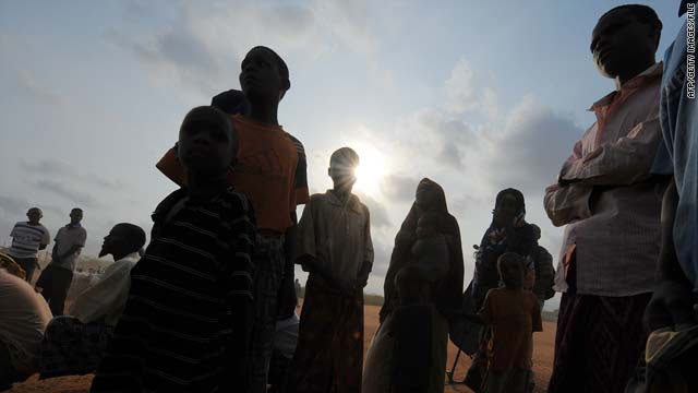 Newly arrived Somali refugees stand outside the UNHCR registration centre at the Ifo camp in Dadaab, Kenya, on September 9.