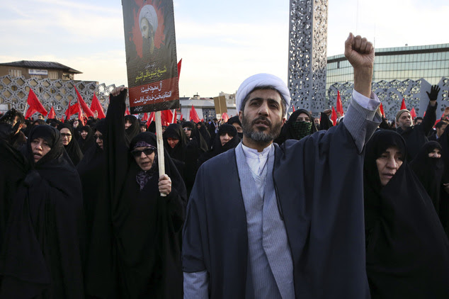 A Muslim cleric chants slogans alongside women in a rally to protest the execution by Saudi Arabia last week of Sheikh Nimr al-Nimr, a prominent opposition S...