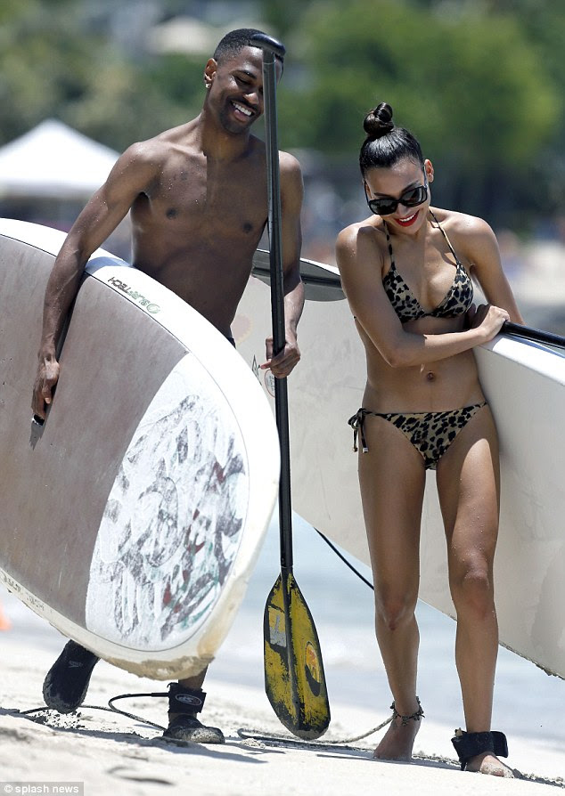 Keeping her close: It might only be early days, but the two stars seemed keen to spend their day alone together 