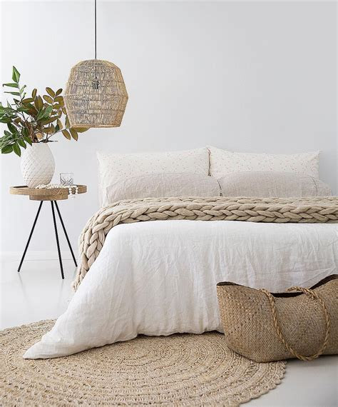bedroom  white linens  woven basket lighting
