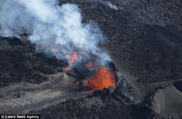 Images of the gaping fissure, volatile lava fountains and a billowing cloud of steam and gas reveal the raw beauty and brute force of volcanic activity