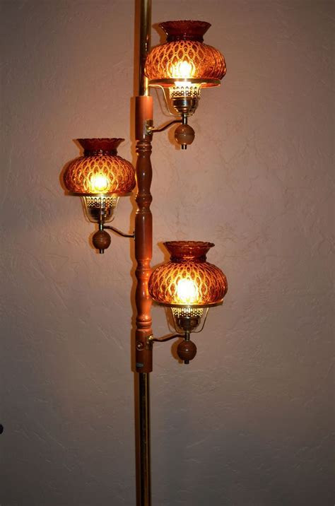 Holding different light bulbs photo by: Vintage 60s 70s Tension Pole Lamp w/Amber Glass Shades 3
