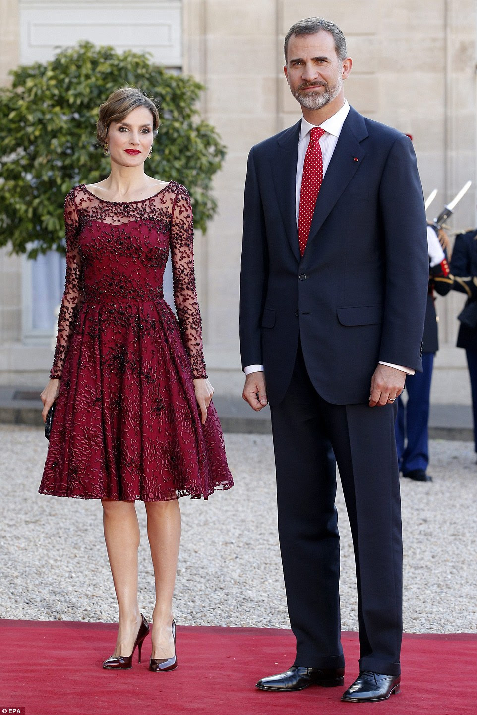Letizia looked stunning in a plum dress, which she accessorised with plum patent court shoes 
