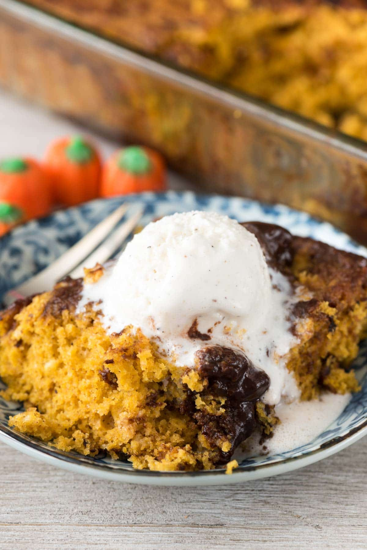 Pumpkin Hot Fudge Pudding Cake - this easy pumpkin cake recipe starts with a cake mix and is baked with chocolate that turns into hot fudge pudding!