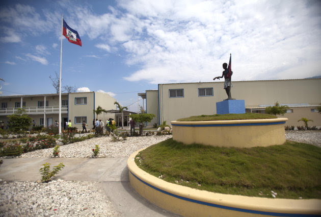 <p> In this March 15, 2013 photo, Haiti's national flag flies outside parliament which was renovated by Chemonics International Inc., a for-profit international development company based in Washington D.C., in downtown of Port-au-Prince, Haiti. A new report on American aid to Haiti in the wake of that country's devastating earthquake finds much of the money went to U.S.-based companies and organizations while just 1 percent went directly to Haitian companies. The obstacles blocking Haitian businesses from the contracts are many: they're often not competitive because they may not be able to get the financing they need from local banks, and smaller firms also lack the resources to prepare time-consuming applications and pay for the lobbyists and lawyers needed to win contracts. (AP Photo/Dieu Nalio Chery)