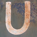 U white paint on blue - rusting