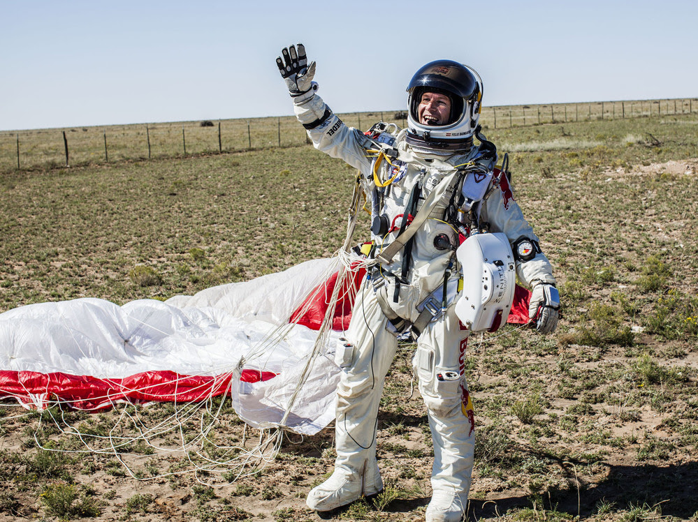 Pilot Felix Baumgartner of Austria celebrates after successfully jumping 24 miles from the stratosphere in Roswell, N.M., Sunday.