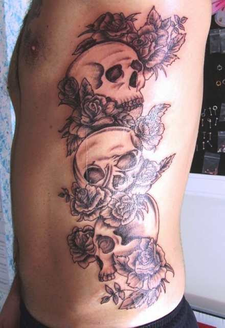 Skull on Ribs Tattoo